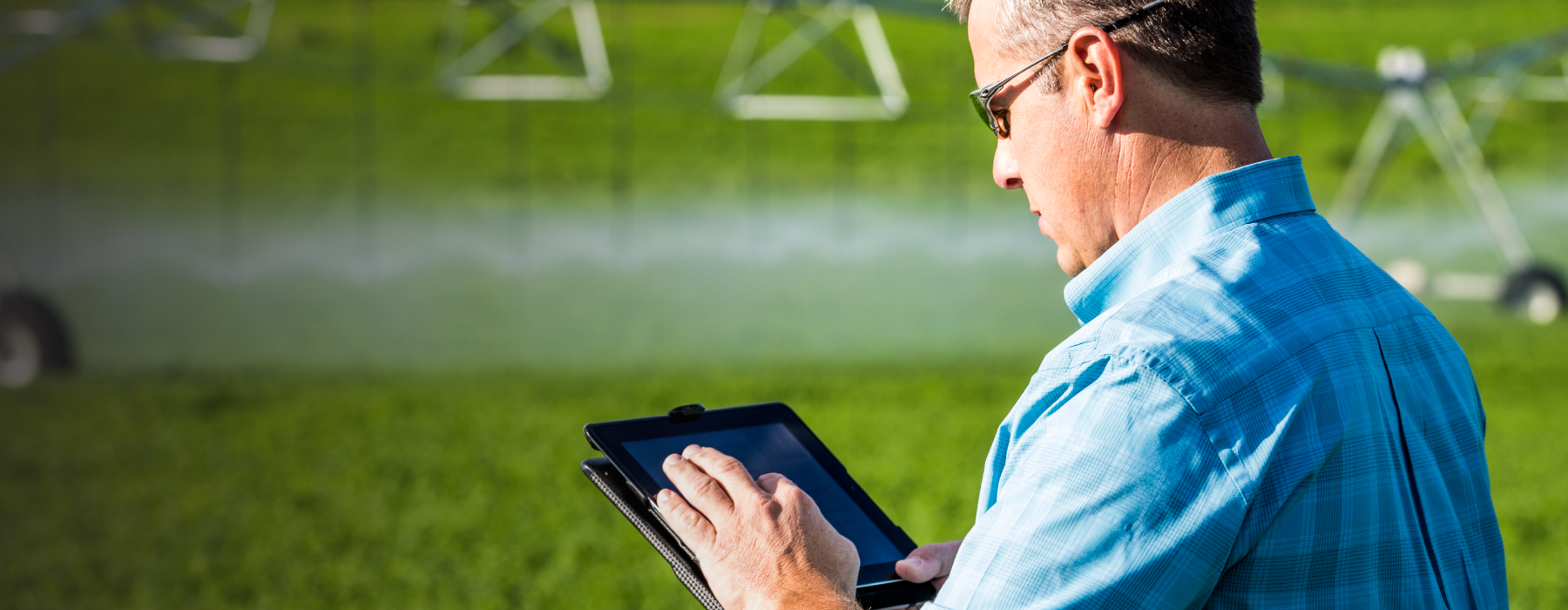irrigation.education pivot in a field with a dramatic sky