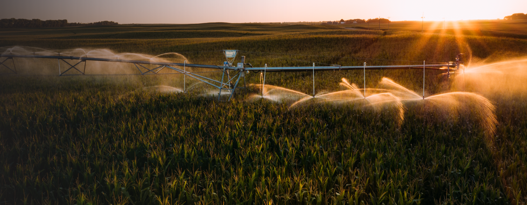 irrigation.education pivot in a field with a dramatic sky