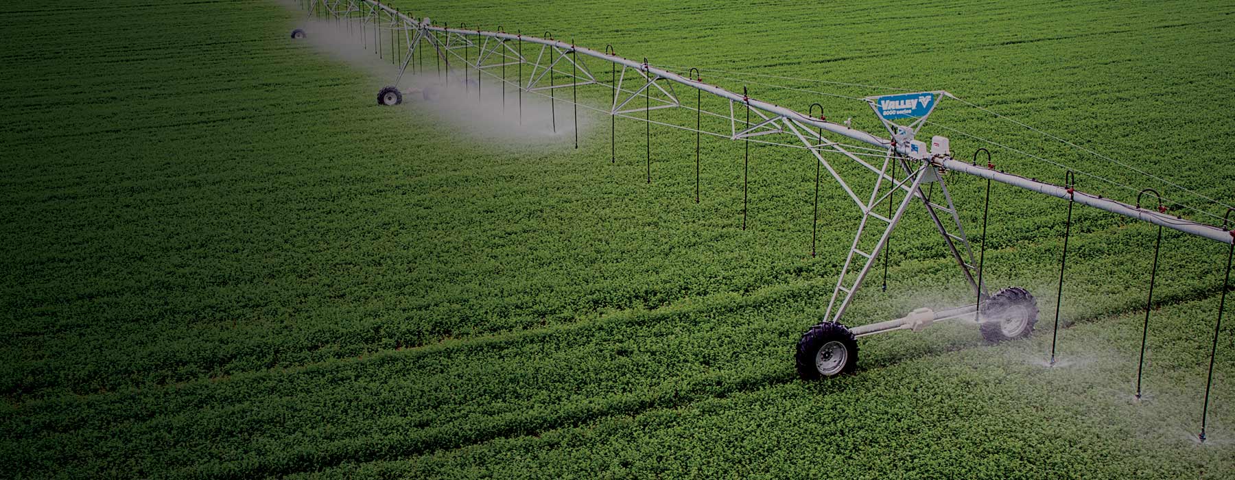 valley center pivot irrigating over crops